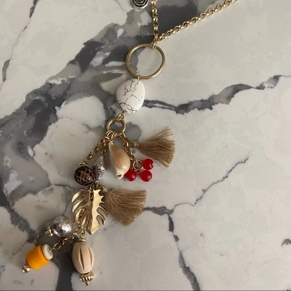 Chico’s long Kira gold tone charm necklace